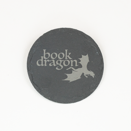 A round black slate coaster featuring the words 'Book Dragon' in a stylized light gray font and a matching dragon silhouette, shown on a plain white background.