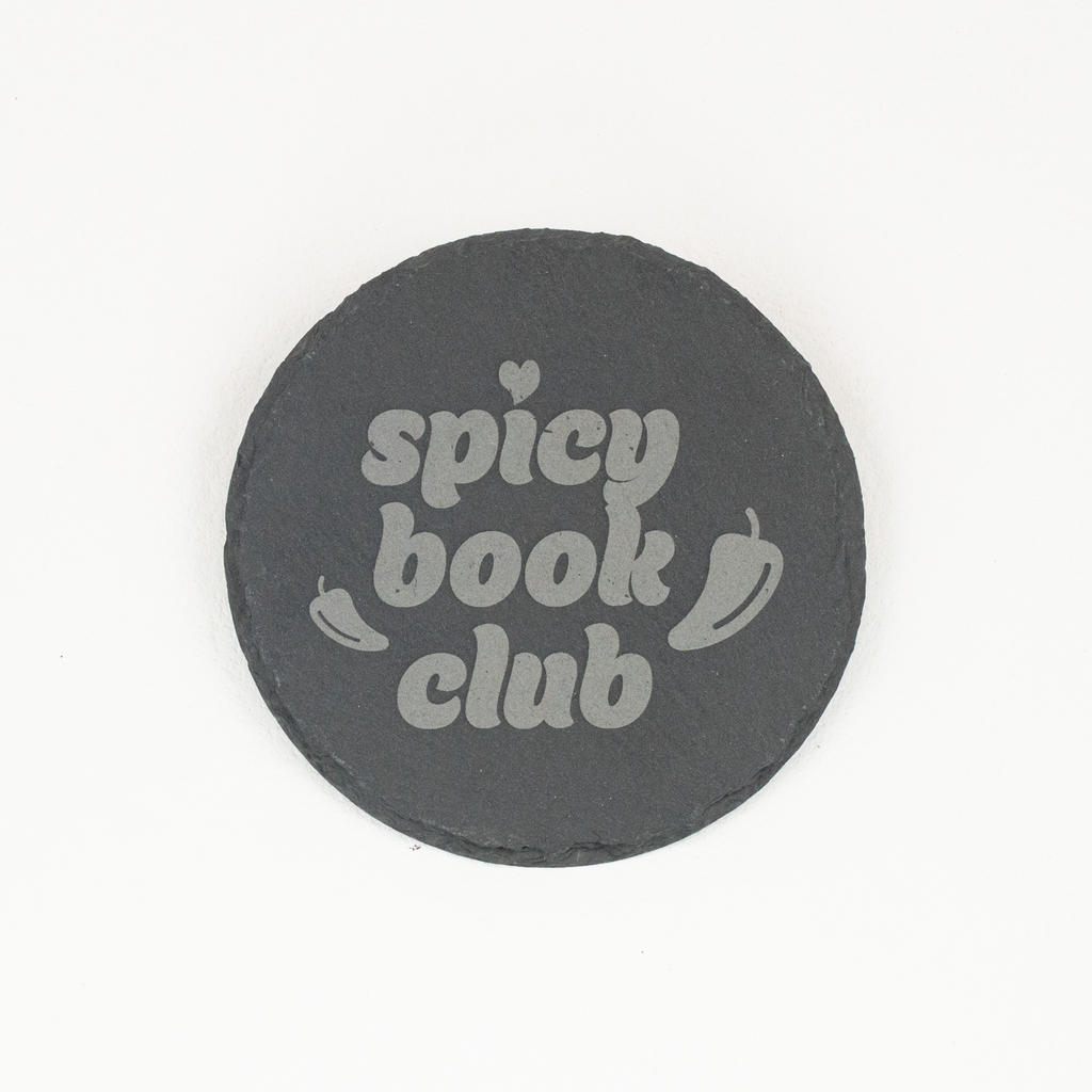 Round slate coaster with 'Spicy Book Club' engraved
