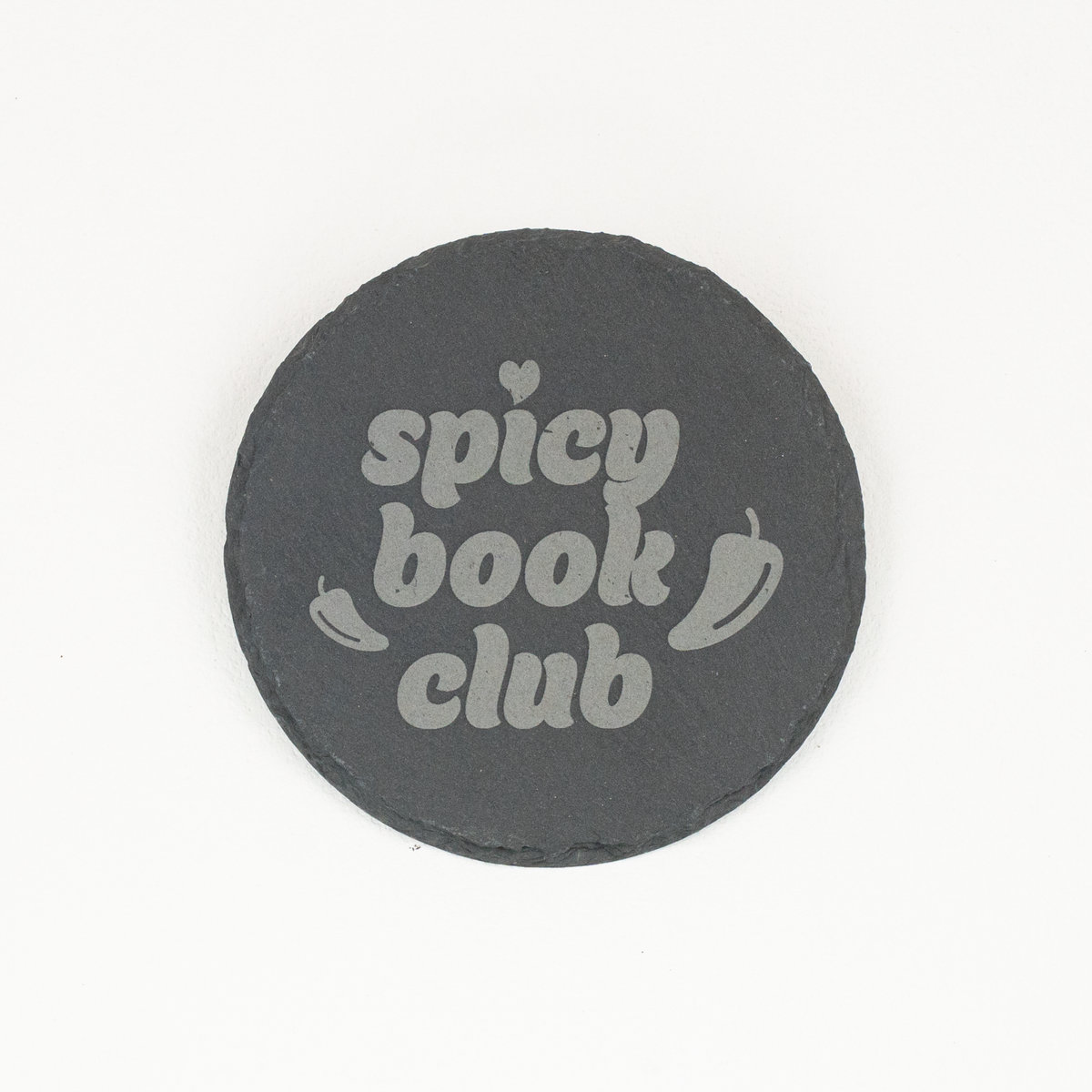 Round slate coaster with 'Spicy Book Club' engraved